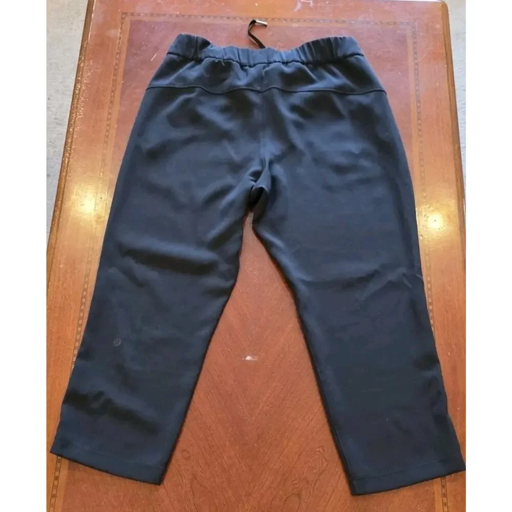 Lululemon On The Fly Black Drawstring Crop Pants Size 8 W6AVMS Athletic Casual